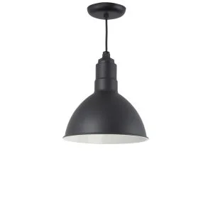 A matte black barn pendant light with a white interior hangs from a black cord