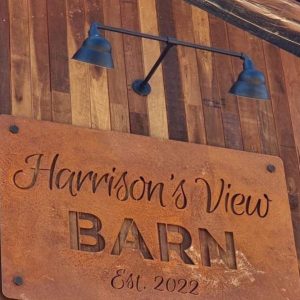 Black Sign Light with Coreten Steel Laser Cut Sign on Timber Barn