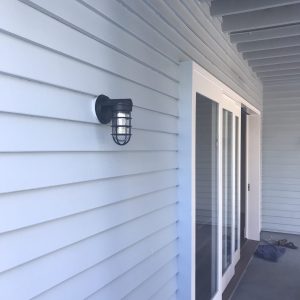 Black Static Industrial on Weatherboard shown next to white sliding doors