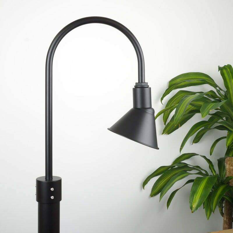 20cm Frontier Post Mount Light in Black Ace shown with white background and plant adjacent