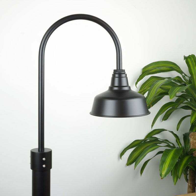 25cm Eclipse Post Mount Light in Black Ace on White Wall with Green Plant adjacent
