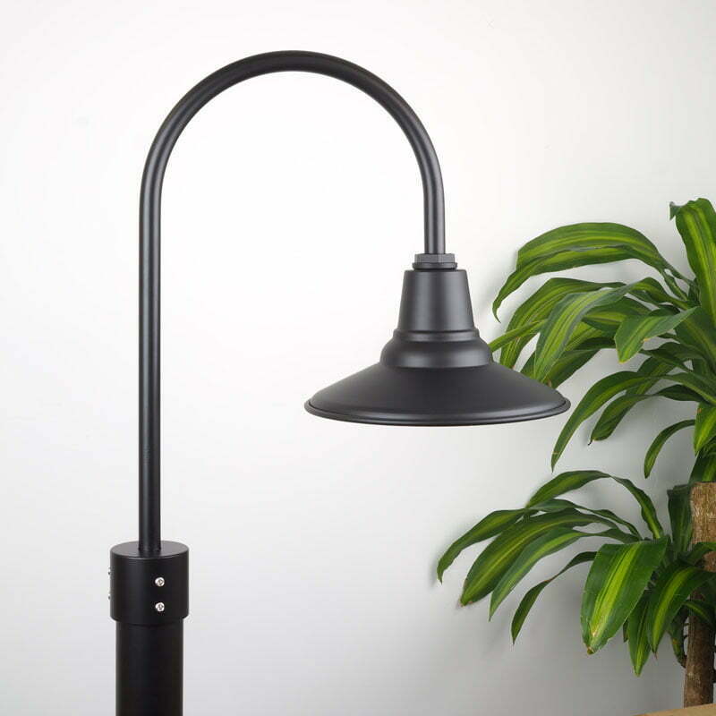 30cm Astro Post Mount Light in Black Ace on White Background with Green Plant adjacent