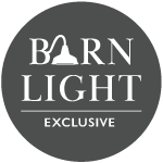 A circular logo for Barn Light Exclusive features a stylized barn light graphic above the text "BARN LIGHT" and "EXCLUSIVE"