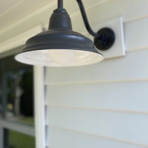 Black Gooseneck Light on White Weatherboards