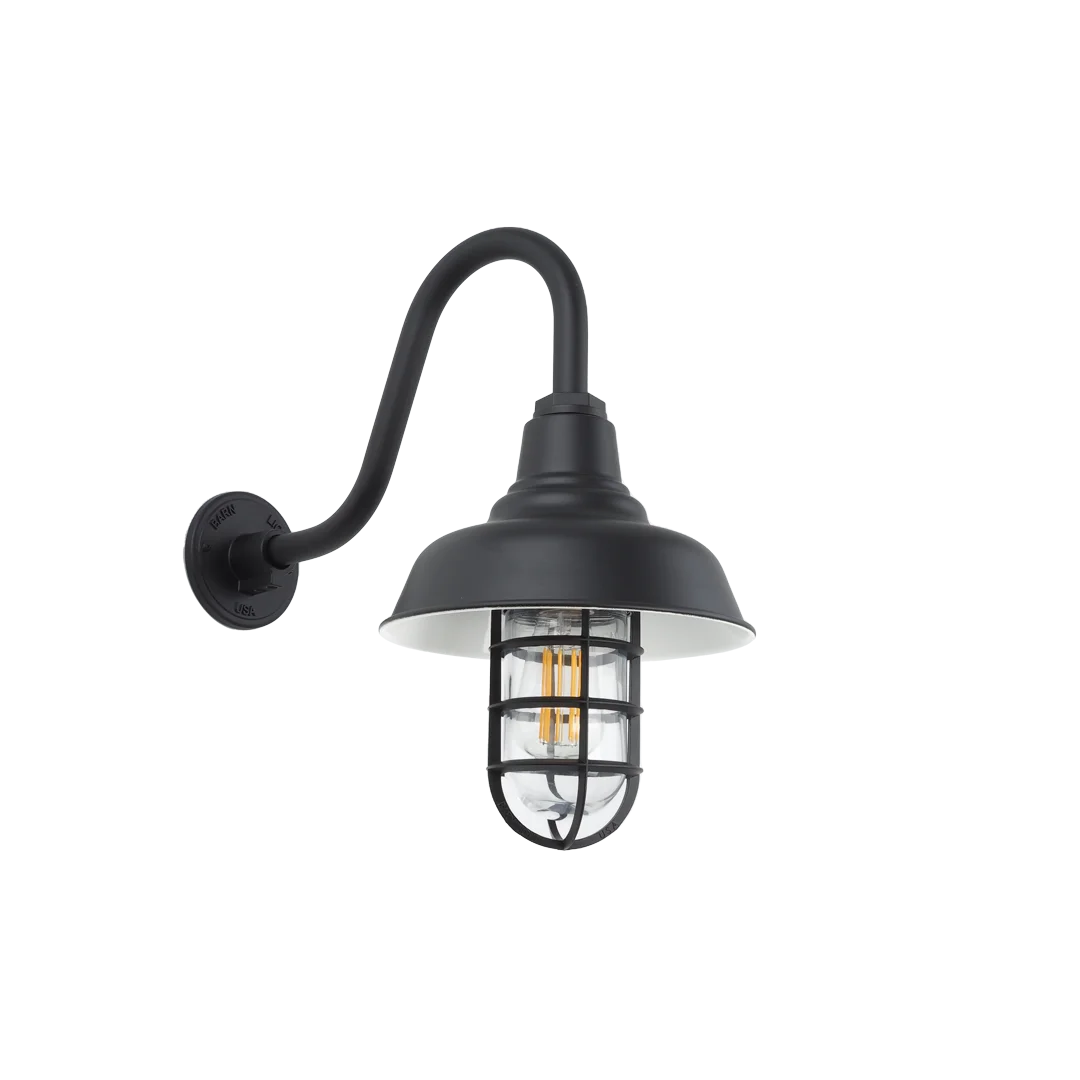A black gooseneck wall light with a caged glass shade is shown against a black background