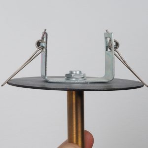 A close-up shot shows the mounting bracket and hardware for a lighting fixture