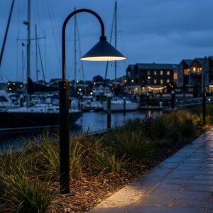 The Hobart Outdoor Post Mount in 38 cm lit at dusk along a harbour path - artificially generated scene, reviewed and approved by Jesse Stringer