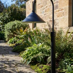 The Hobart Outdoor Post Mount in 38 cm beside a daytime stone cottage - artificially generated scene, reviewed and approved by Jesse Stringer