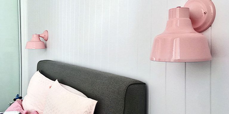 Pink Wall Light next to Bed in Bedroom