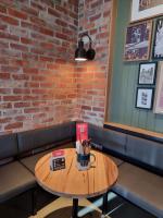 cafe_cottage_wall_light_black_ace_grilld_brick_wall_corner_table